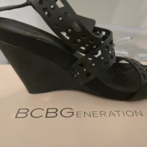 BCBGeneration Black Laser-Cut Studded Wedge Sandals